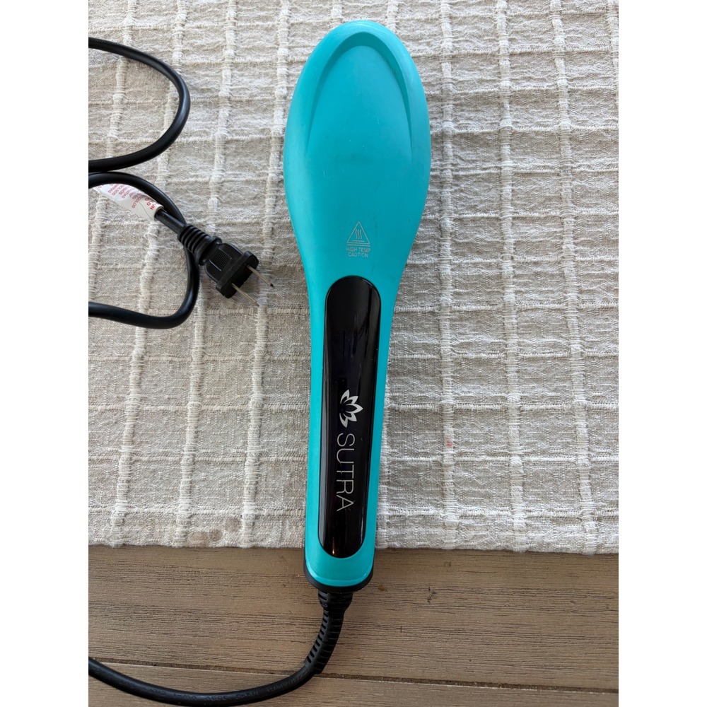 Sutra Ionic Heat Brush in a teal and black, tested works